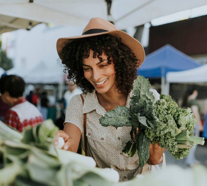 Shopping at a local farmers market near Allers Landing apartments in Austin, Texas